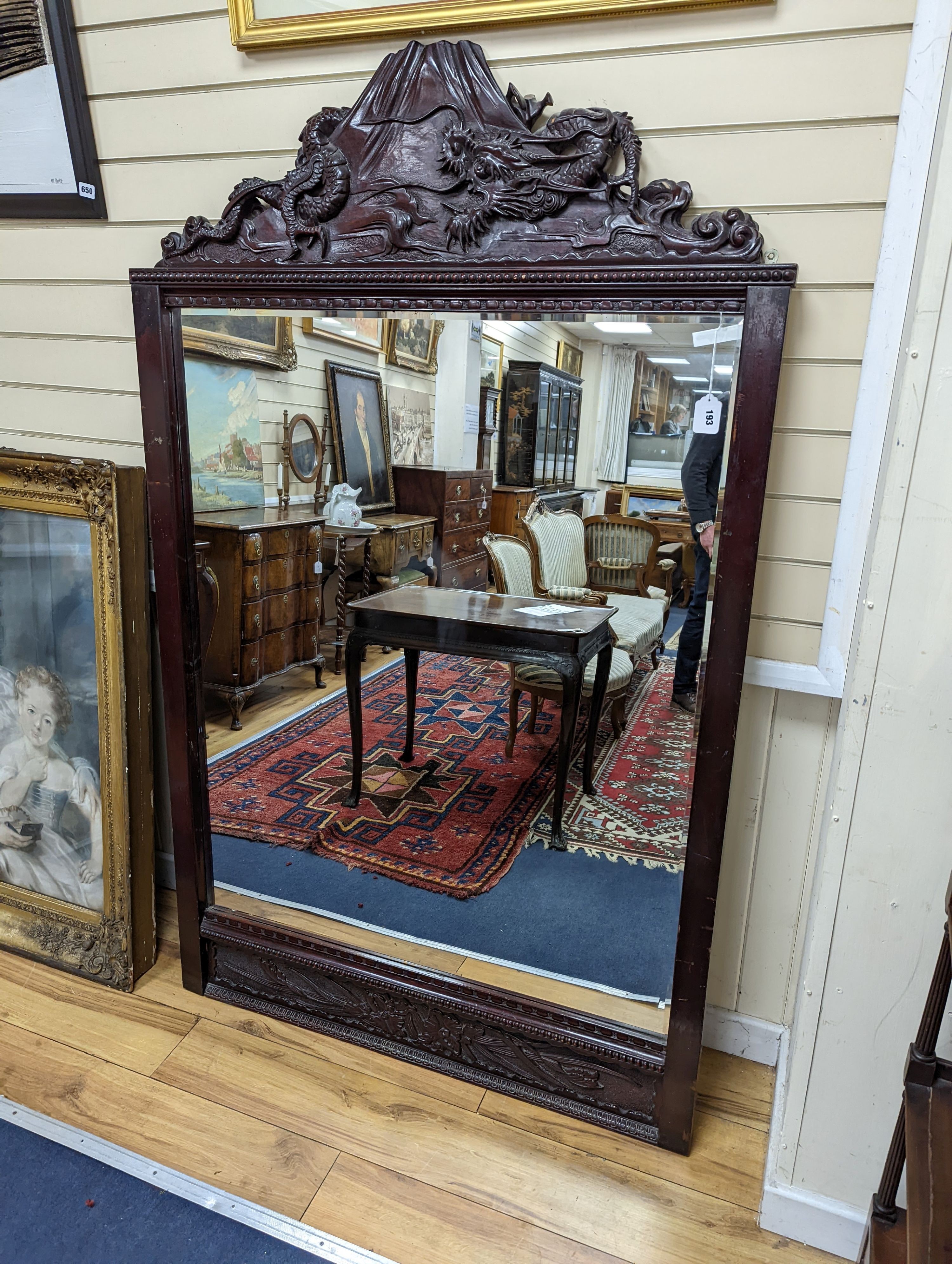 A Japanese carved hardwood dragon overmantel mirror, width 112cm, height 180cm